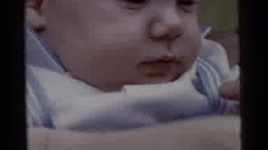 Gary Indiana USA (1961): Small Baby Smiling While Held In The Arms Of A Person