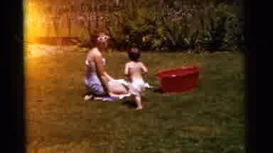 Gary Indiana USA (1961): A Mother With Her Son Playing In The Yard And Swimming In