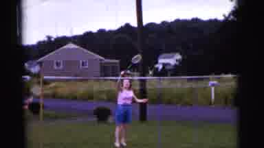 Gary Indiana USA (1961): Four People Are Outside Playing Badminton On Their Front
