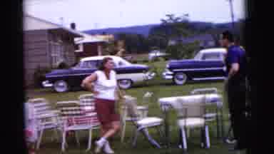 Gary Indiana USA (1961): Man And Woman Standing In Yard With Empty Tables And