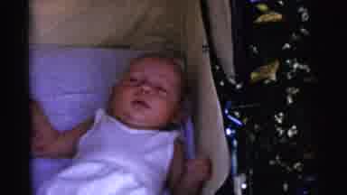 Gary Indiana USA (1961): Twin Infants Wearing White Shirts Lie In Yellow Bassinet