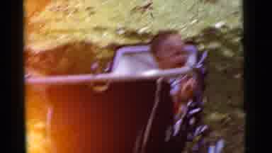 Gary Indiana USA (1961): A Small Baby Giggles While Sitting In An Old Fashioned