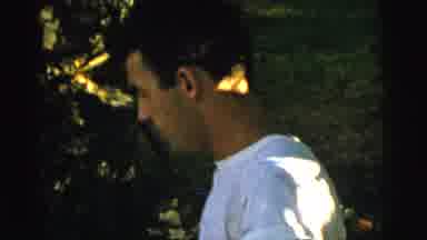 Gary Indiana USA (1961): Man Woman And Child Are Outside While The Child Is Being