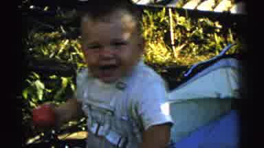 Gary Indiana USA (1961): Toddler Holding A Red Apple Smiling And Looking At The