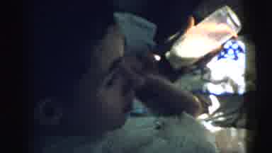 Gary Indiana USA (1961): Man Feed Baby A Bottle Then The Toddler Goes Outside To