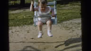 Gary Indiana USA (1961): A Toddler Being Pushed In A Swing At A Park And Laughing