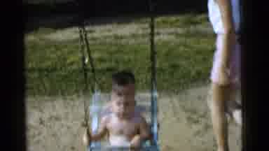 Gary Indiana USA (1961): Child Being Pushed In A Swing By A Woman On A Sunny Day