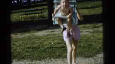 Gary Indiana USA (1961): The Mother Swinging Her Son In Their Backyard And He