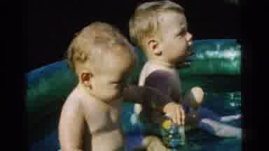 Gary Indiana USA (1961): Two Adorable Toddlers Sitting In A Small Blow Up Swimming
