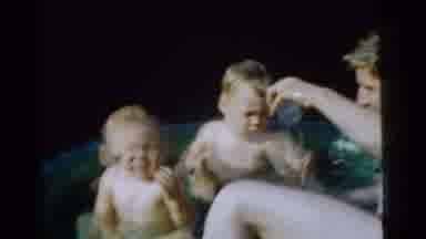 Gary Indiana USA (1961): A Dad Playing In A Small Inflatable Pool With Two Sons