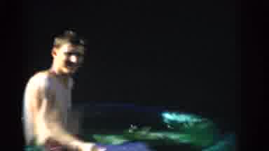 Gary Indiana USA (1961): Man Spraying Water From An Inflatable Pool Before Toddler