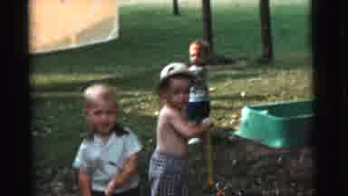 Gary Indiana USA (1961): Three Little Boys Playing Outside With Little Toy Push