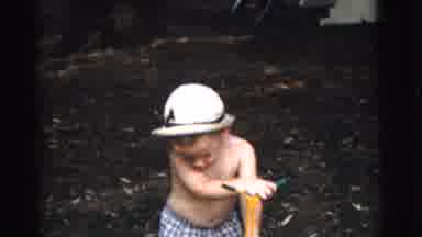 Gary Indiana USA (1961): Three Boys Play With Mechanical Lawn Mowers In A Backyard