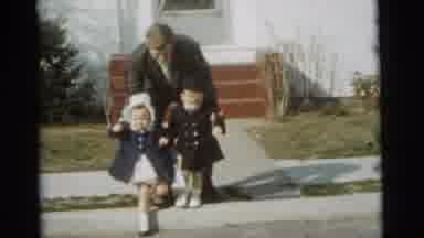 Gary Indiana USA (1961): Clip Of A Man Helping Two Children Walk Across The Street