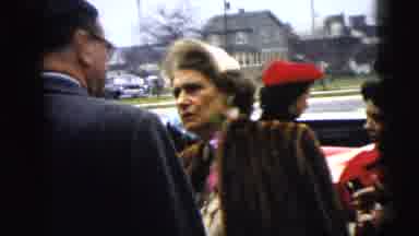 Moline Illinois USA (1962): Serious Woman Wearing A Fur Coat Talking To A Man Next