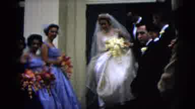 Moline Illinois USA (1962): Woman Walking Out Of A Building With Her Wedding Dress