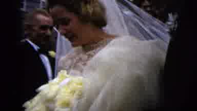 Moline Illinois USA (1962): Woman Wearing White Wedding Dress Carries Yellow