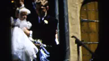 Moline Illinois USA-1962: A Little Girl In A White Dress Is Being Carried By An