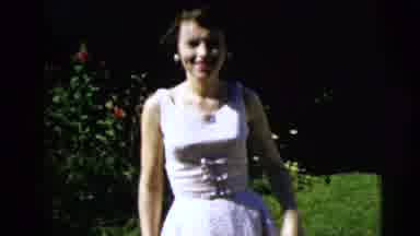 Moline Illinois USA (1962): Adult Woman Takes Off In White Dress Laughing Alone On
