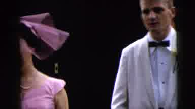 Moline Illinois USA (1962): Dressed Up Men And Women Walk Together Into A Fancy
