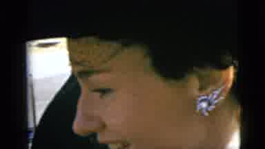 Moline Illinois USA (1962): Woman Talking And Noticing Camera Focusing On Her
