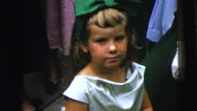 Moline Illinois USA (1962): A Girl In A Green Boy Looks The Camera
