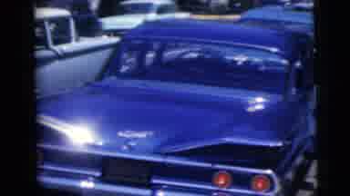 Moline Illinois USA (1962): Well Dressed Adults Stand Next To A Shiny Old Black