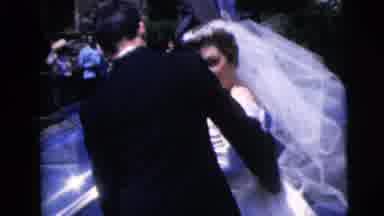 Moline Illinois USA (1962): Newlyweds Approaching Car Husband Guiding Wife To Get
