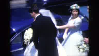 Moline Illinois USA (1962): Two Men Two Women One Bride Getting Into Car On Street