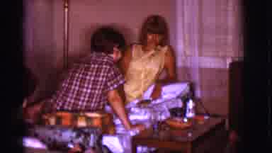 Clarkdale Arizona (1966): Man Plays With Dog On Floor While Two Women Talk On Sofa