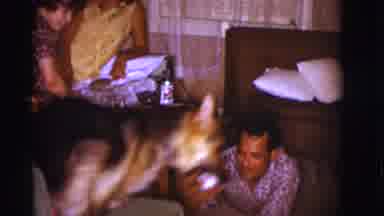 Clarkdale Arizona (1966): Man Sitting On The Floor Playing With His Dog As Seated