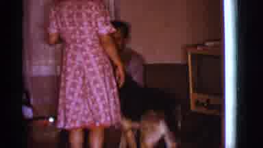 Clarkdale Arizona (1966): A Dog Is Inside A Home With A Man And Woman Most Likely