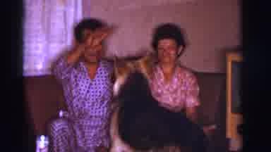 Clarkdale Arizona (1966): Man And Woman Sit On Couch Man Plays With German
