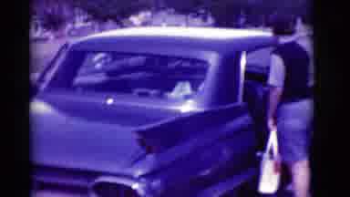 Clarkdale Arizona (1966): Two Women Get In Black Car On A Bright Sunny Day
