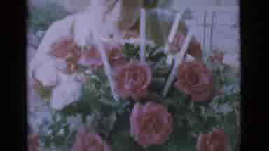 Clarkdale Arizona (1966): An Older Lady Inspects A Full Bouquet Of Beautiful Pink