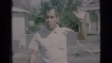 Clarkdale Arizona (1966): Woman Wearing Blue Dress Walks Out Of Camper On A Sunny