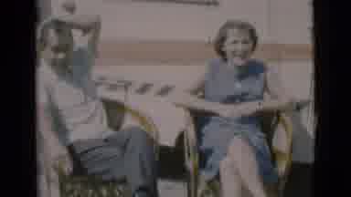 Clarkdale Arizona (1966): Middle Aged Couple Sitting On Chairs Outside A Caravan