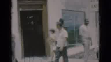 Clarkdale Arizona (1966): Man Wearing A Side Purse Walking Around A Street On An