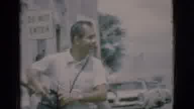 Clarkdale Arizona (1966): Adult Man Walking Down The Street And Taking A Camera