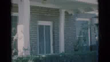 Clarkdale Arizona (1966): Video Of A Brick House With White Pillars In The Front