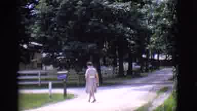 Clarkdale Arizona (1966): Lady Walking Up Tree-Lined Road Past Mailbox Into