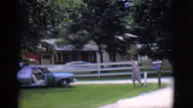 Clarkdale Arizona (1966): Woman Walks To Her Car In Green Area Next To Her