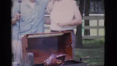Clarkdale Arizona (1966): Man Rotates A Rotisserie Chicken On A Barbecue In The