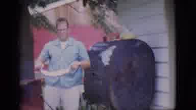 Clarkdale Arizona (1966): Man Picks Up Ribs Then Closes Grill And Goes Back Inside