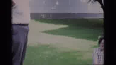 Clarkdale Arizona (1966): Three Happy People Playing With A Dog In The Grass