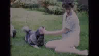 Clarkdale Arizona (1966): Two Women Sit On Grass In Yard One Woman Pets Dog Man