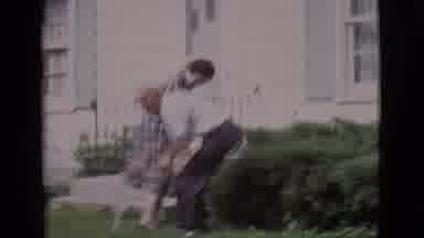 Clarkdale Arizona (1966): Man Watering His Lawn While Women Have Lively