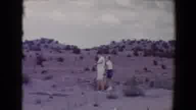 Flagstaff Arizona USA (1967): Two Boys In Shorts Play Outside In A Desert Area