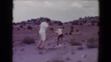 Flagstaff Arizona USA (1967): Two Boys In Shorts Throwing Rocks And Playing In The