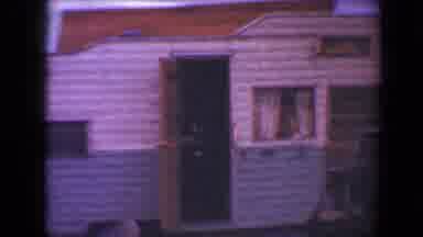 Flagstaff Arizona USA (1967): An Antique Rv With Its Door Ajar Is Shown Attached